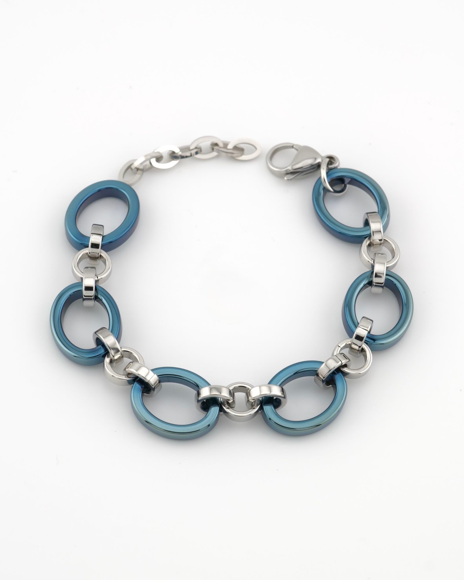 Meridian Chain Bracelet Glacier Blue - ice blue titanium & 18K white gold PVD stainless steel, curled top-down view