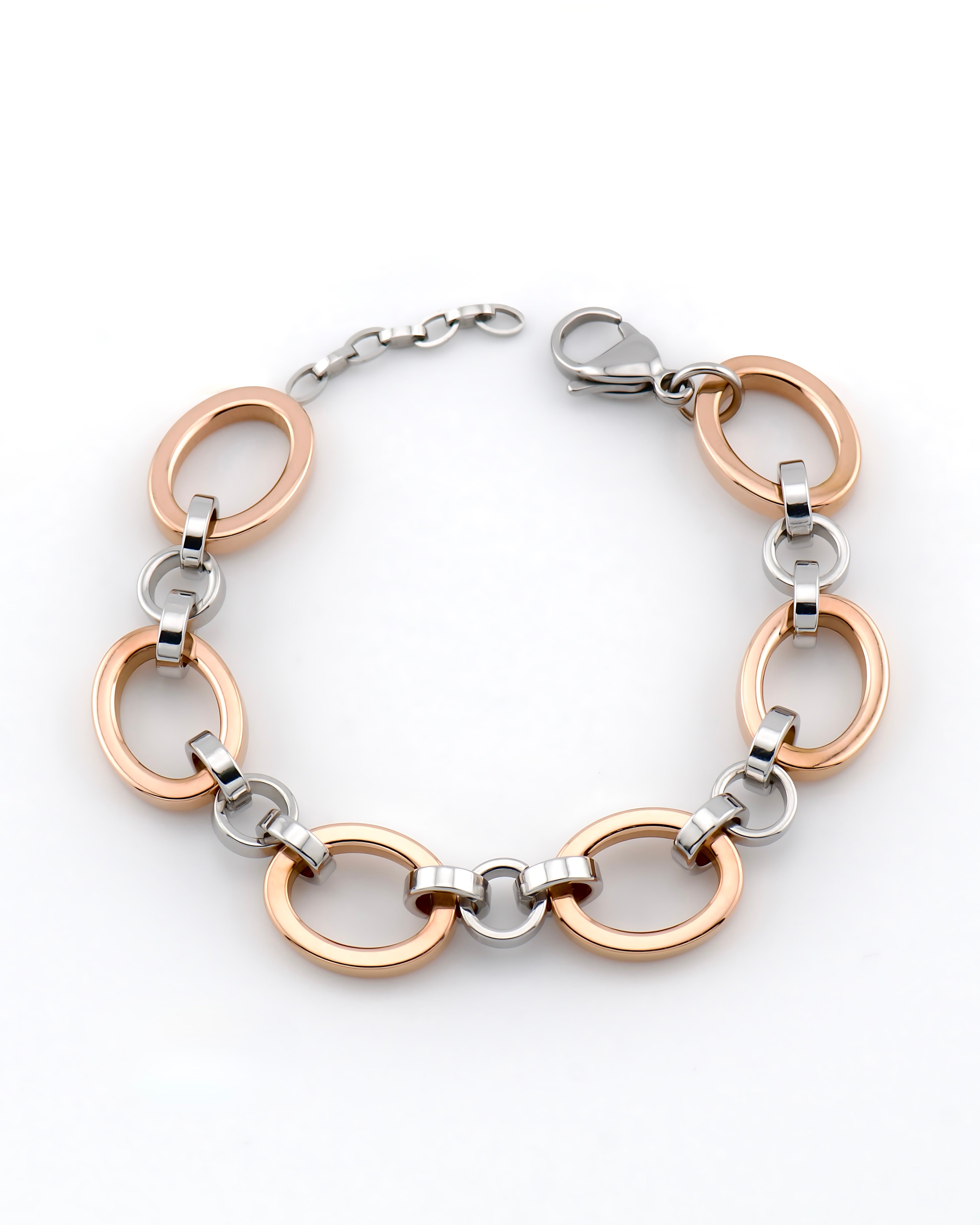 Studio product photo of a rose gold and white gold bracelet curved in a circle on a white background