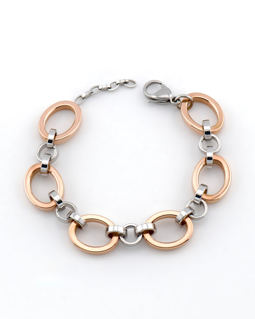 Studio product photo of a rose gold and white gold bracelet curved in a circle on a white background